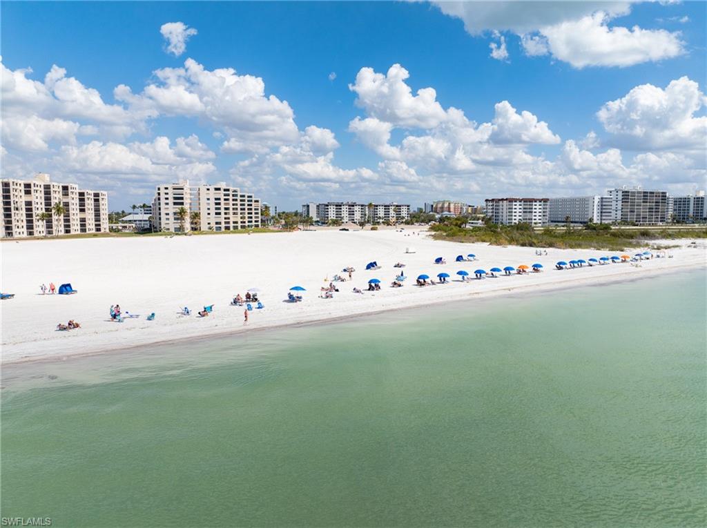 White sandy beach across the street from Estero Cove