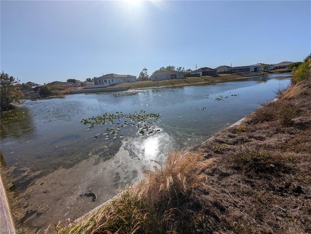 Water view featuring nearby suburban area