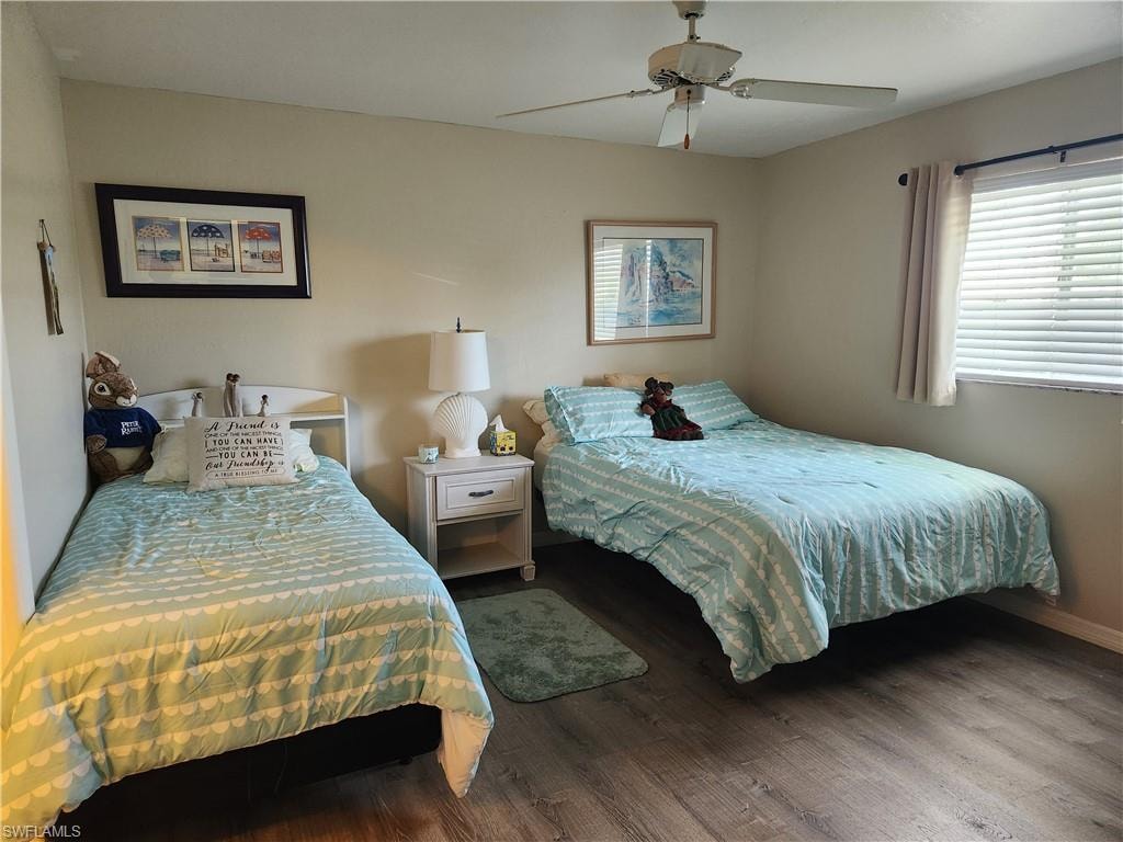 Bedroom with wood finished floors and ceiling fan