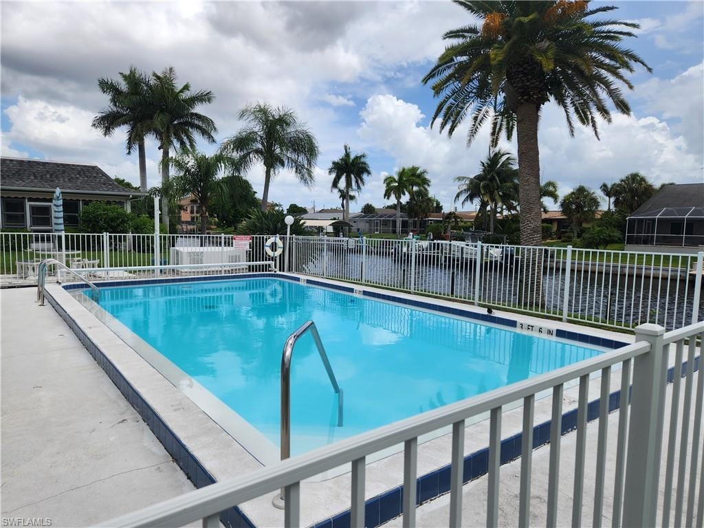 Community pool featuring a patio