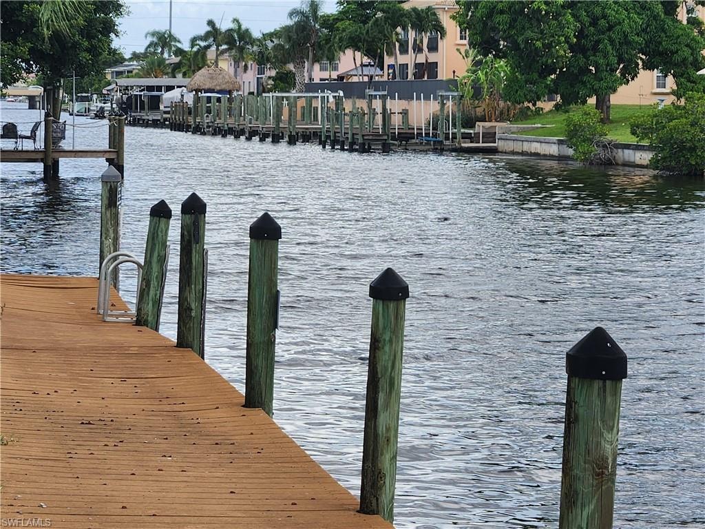 Dock area featuring a water view