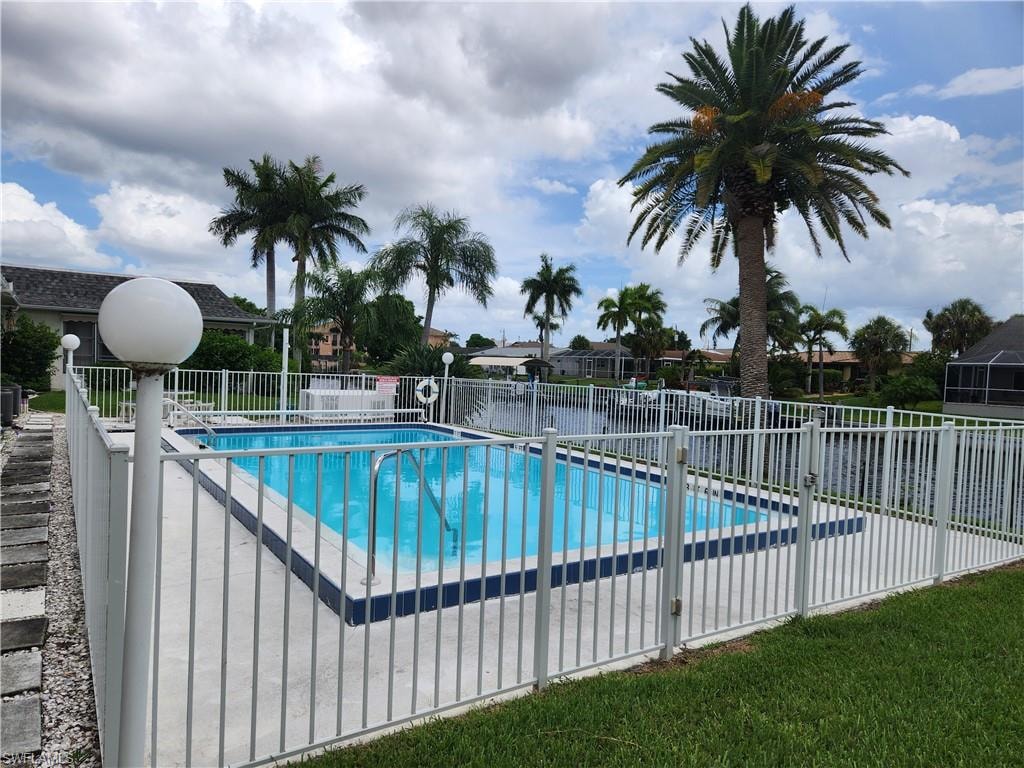 Community pool with a patio