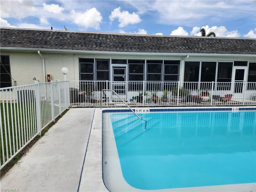Community pool featuring a patio area