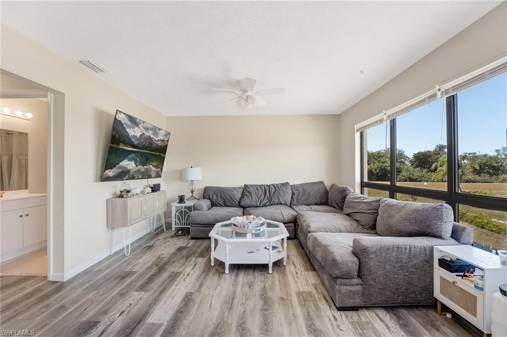 The living area is bright, welcoming, and perfectly positioned to enjoy the waterfront setting.