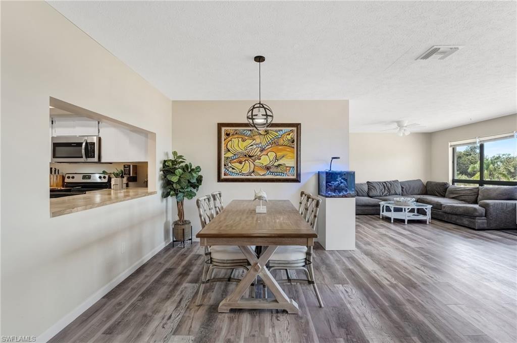 The living area is bright, welcoming, and perfectly positioned to enjoy the waterfront setting.