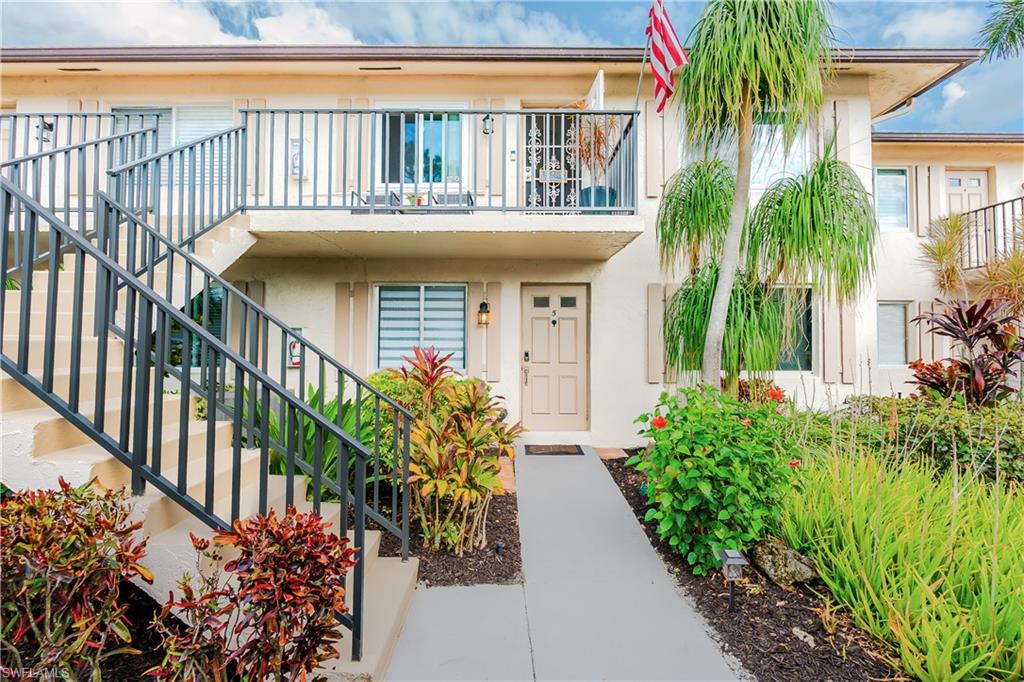 Entrance to property featuring stucco siding