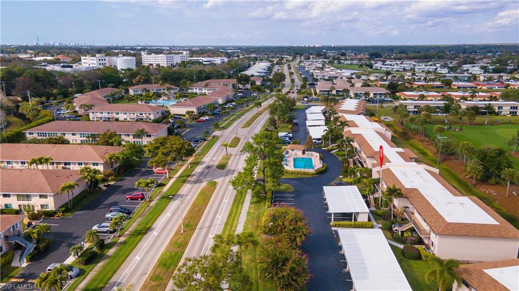 Aerial view of property's location featuring nearby suburban area