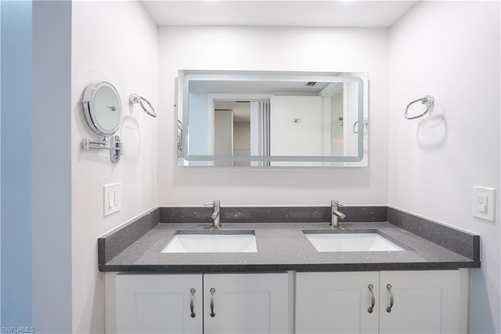Bathroom featuring double vanity
