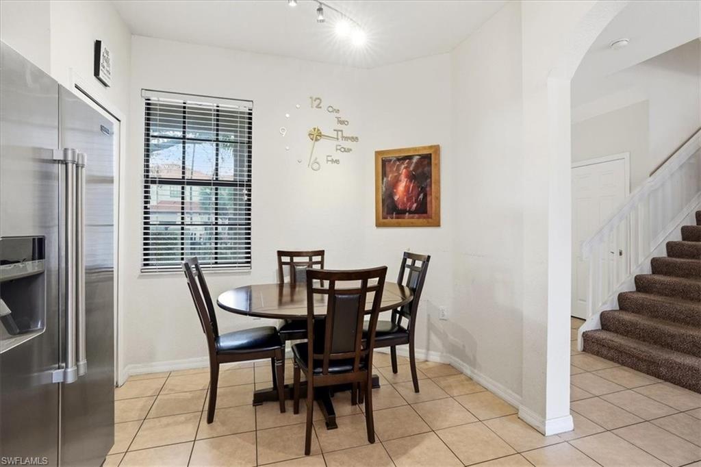 Dining area featuring light tile patterned flooring