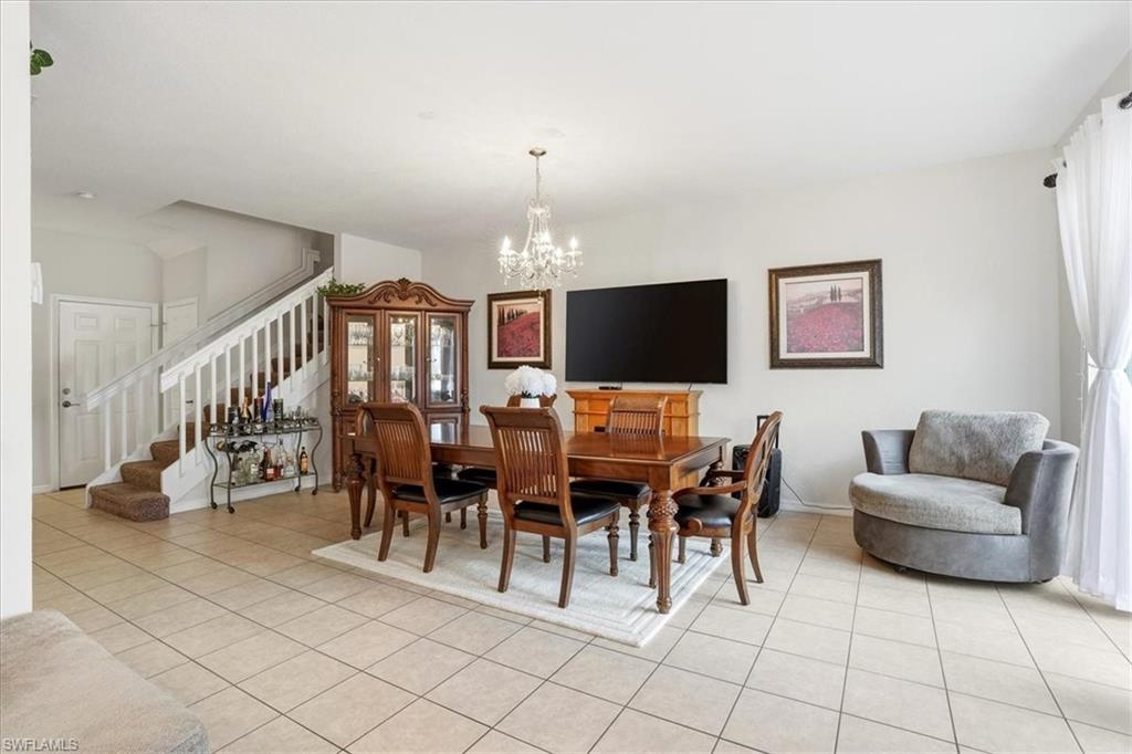 Dining space featuring a chandelier and light tile patterned floors