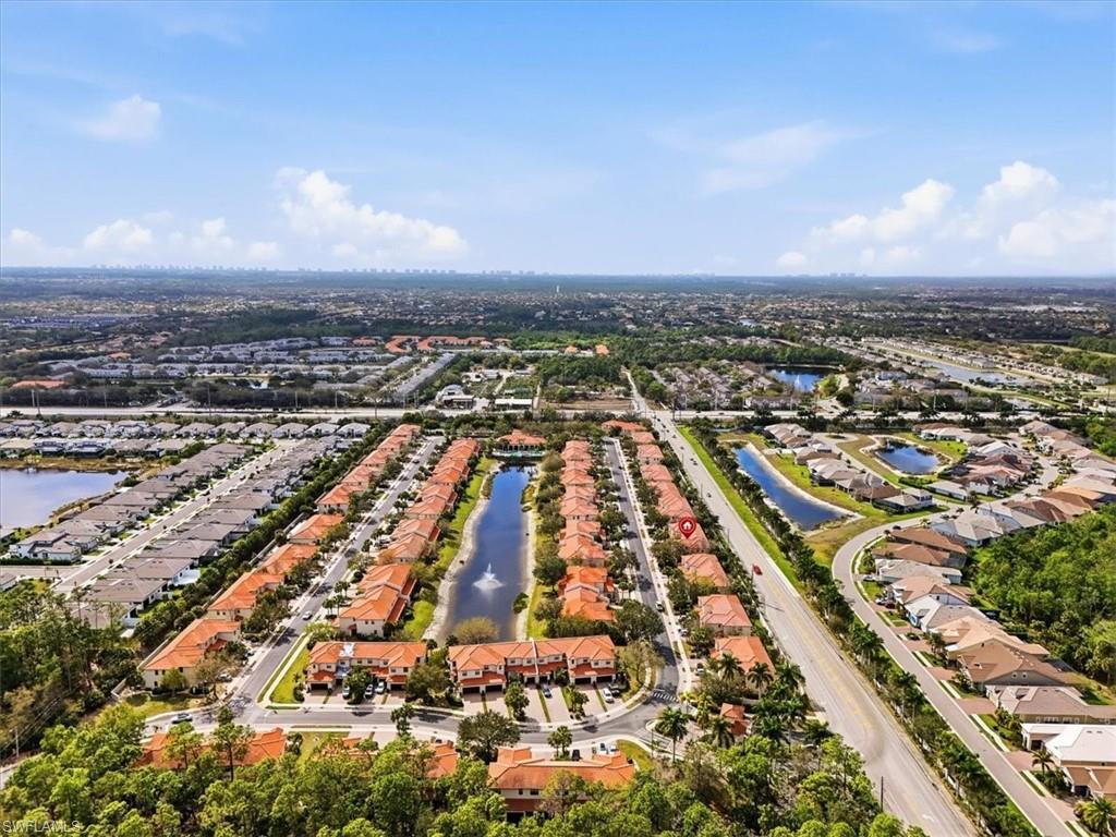 Aerial perspective of suburban area with a large body of water