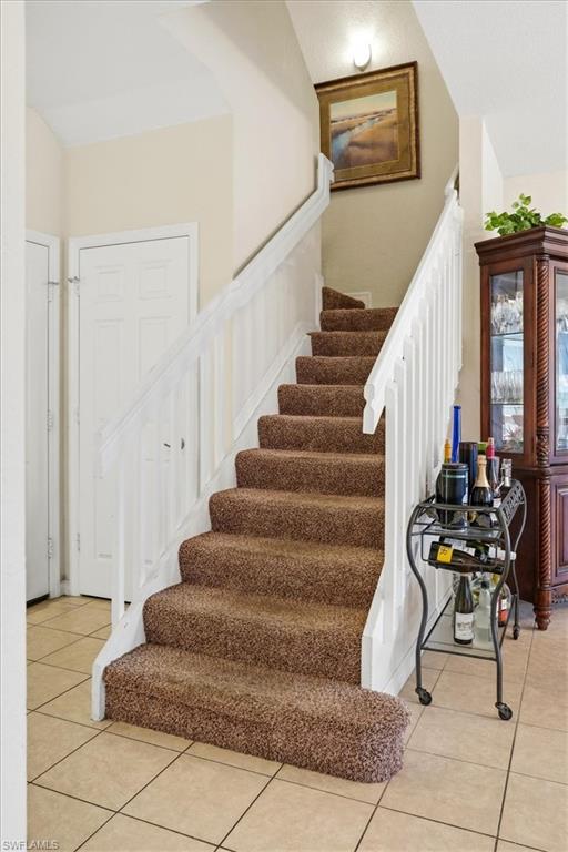 Stairs with tile patterned flooring