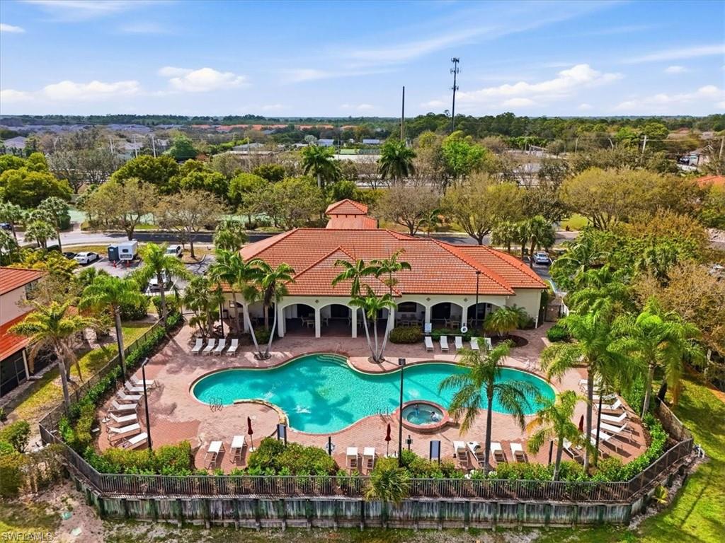 Community pool with a community hot tub and a patio