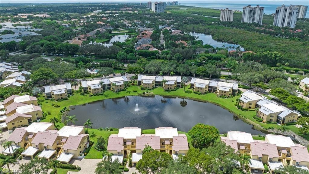 Aerial view of residential area featuring a large body of water