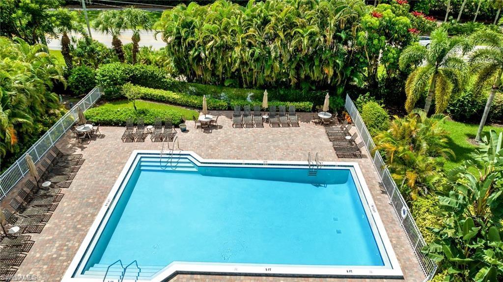 Community pool with a patio