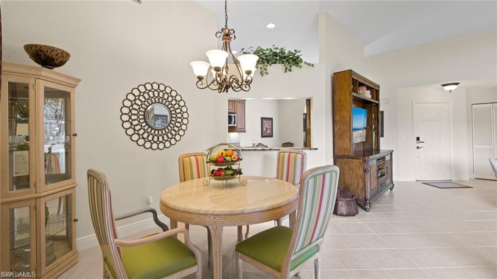 Dining space featuring a chandelier and light tile patterned floors