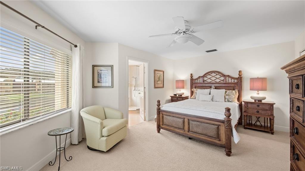 Bedroom with light colored carpet and ceiling fan