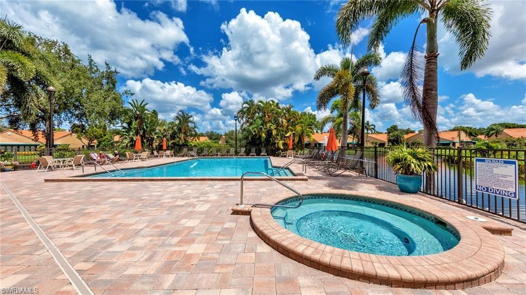 Community pool with a community hot tub and a patio area