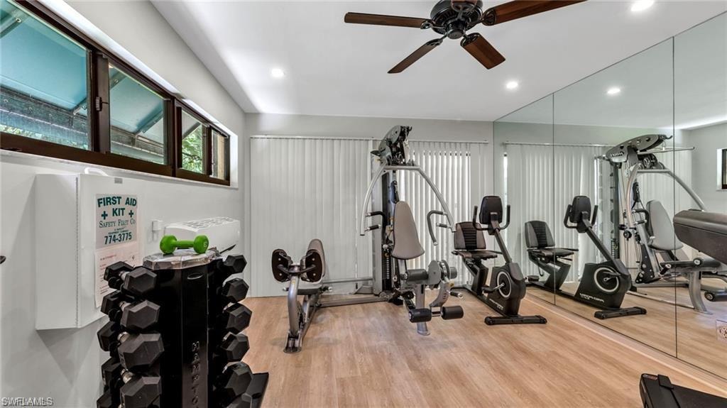 Workout area featuring a ceiling fan and recessed lighting