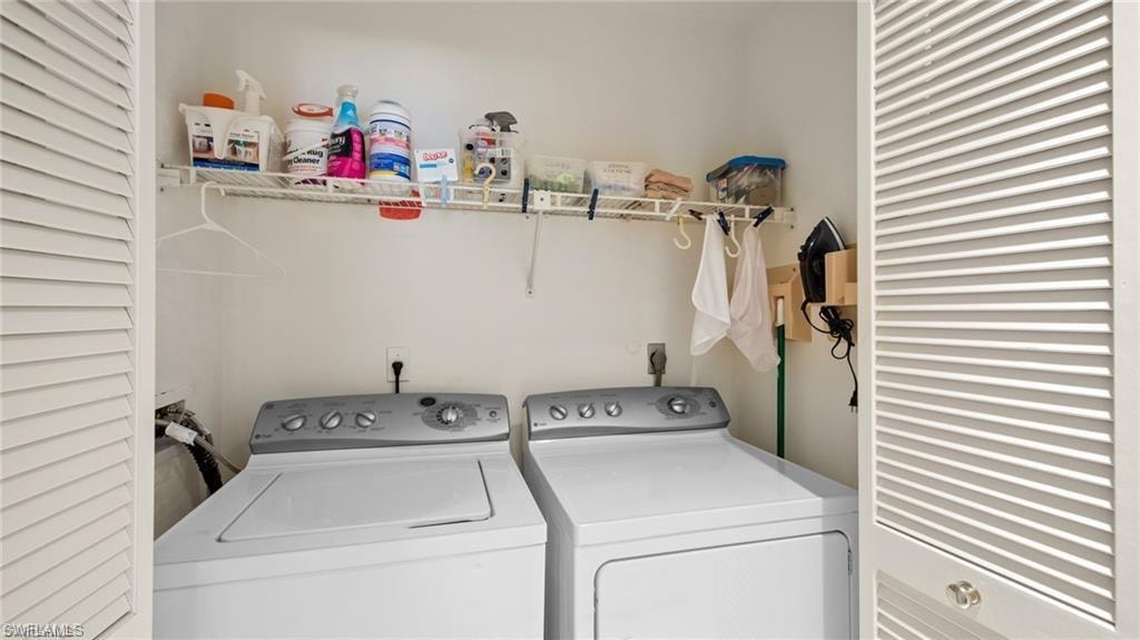 Laundry area featuring separate washer and dryer