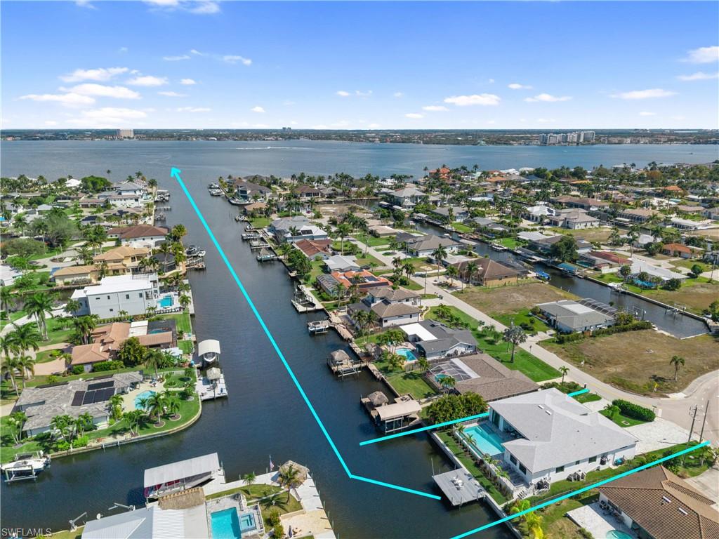 Aerial view of residential area with a nearby body of water