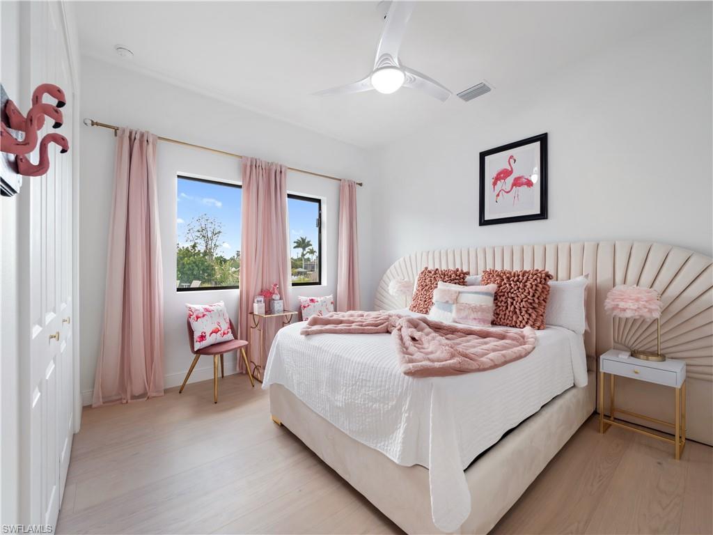Bedroom featuring light wood-style flooring and ceiling fan