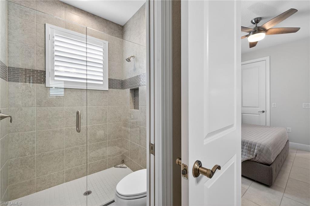 Ensuite bathroom featuring large vanity and a luxury shower stall