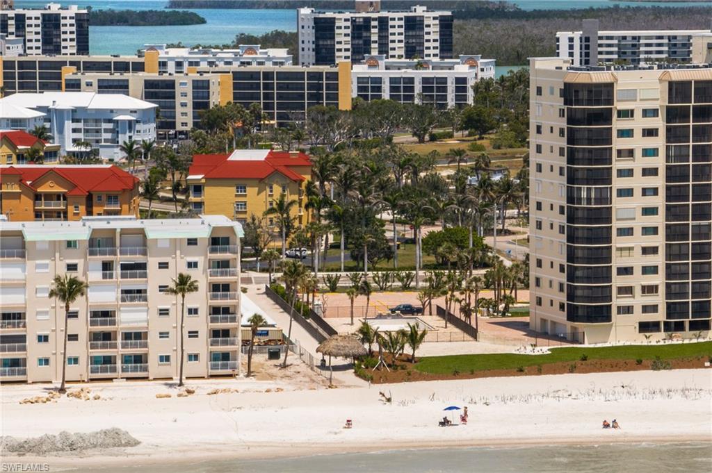 Aerial view of extended coastline and apartment complex / building
