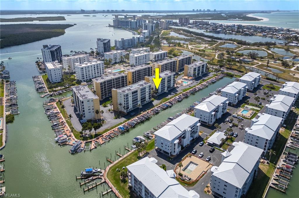 View of urban area featuring a nearby body of water and apartment complex