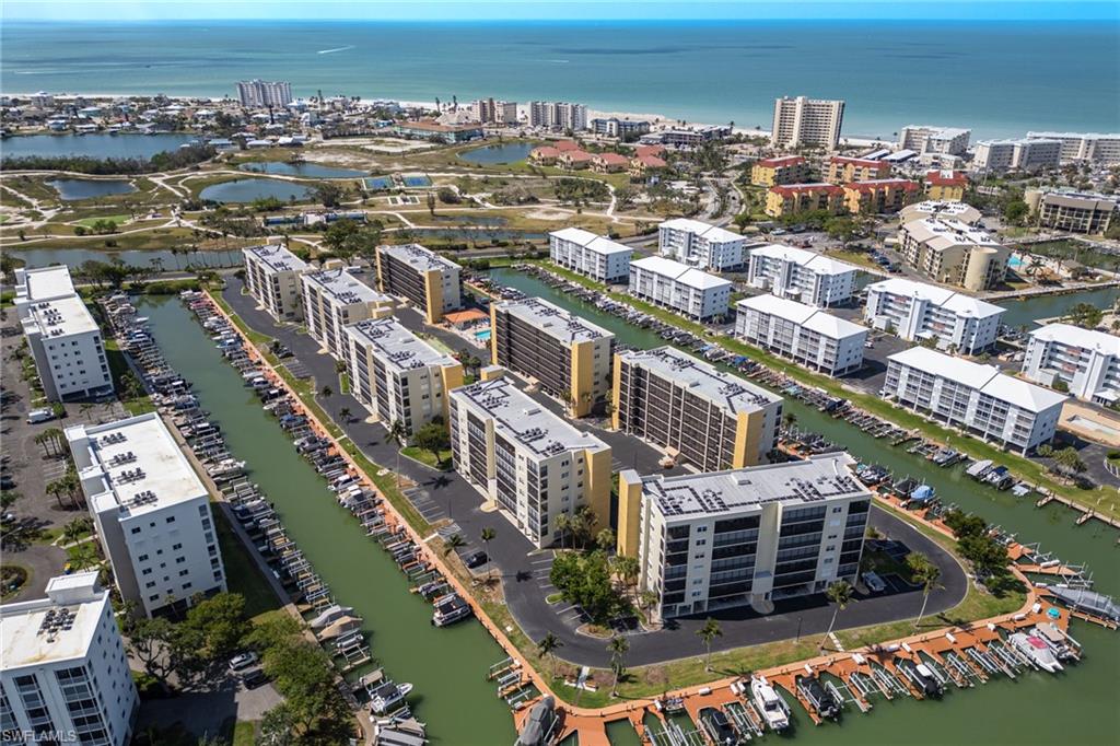 View of property location featuring a large body of water and nearby urban area