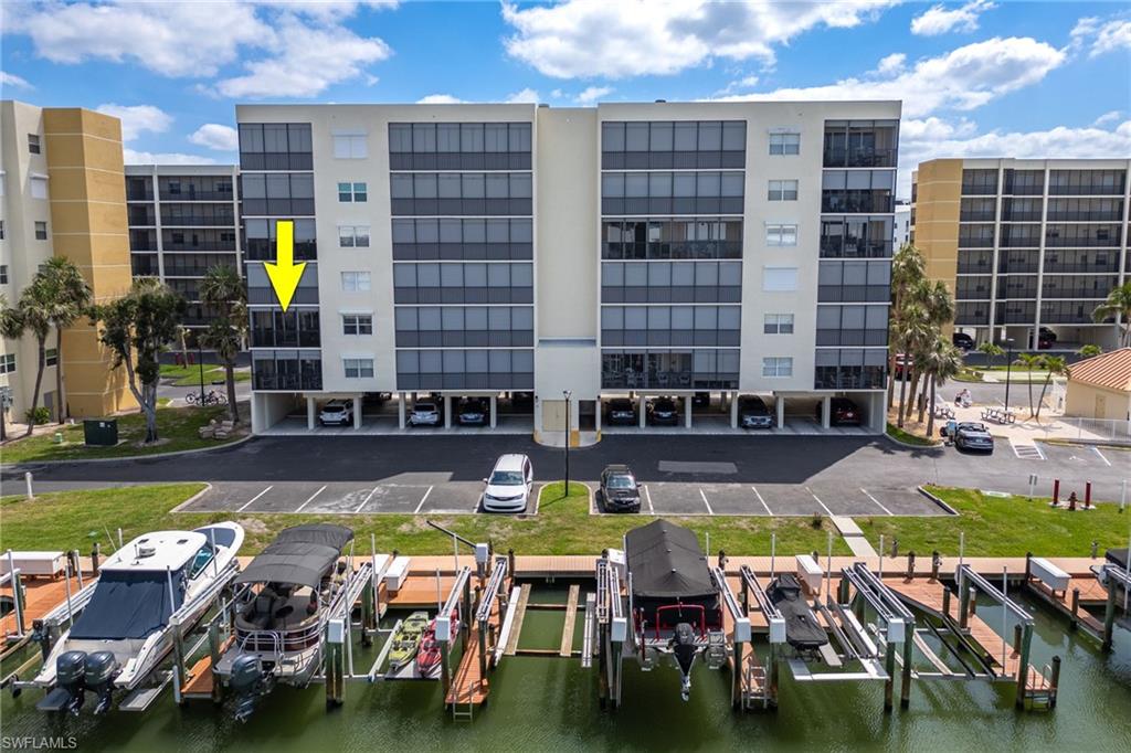 View of apartment building / complex with boat lift