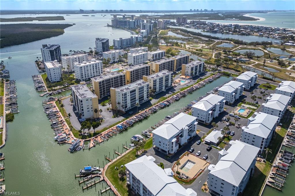 View of urban area with a large body of water and apartment complex