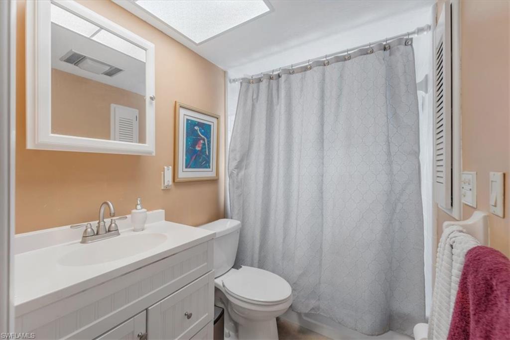 Full bath featuring vanity and a shower with curtain