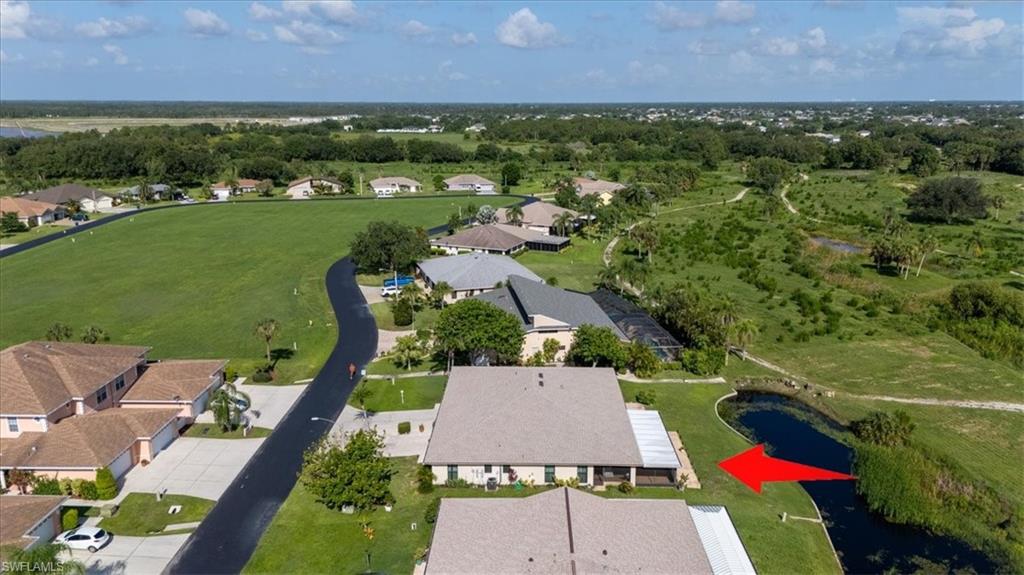 View of property location featuring nearby suburban area and a large body of water