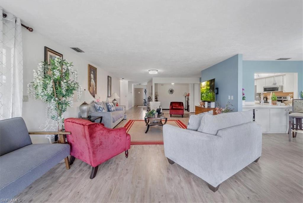 Living room featuring light wood-style floors
