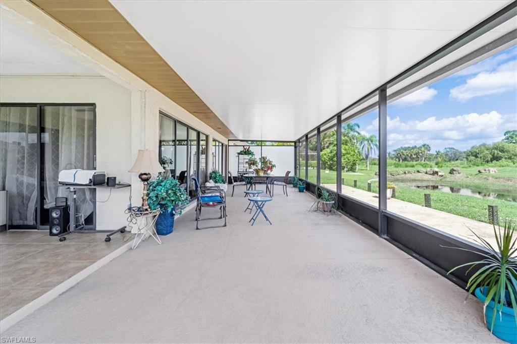 Unfurnished sunroom featuring a water view
