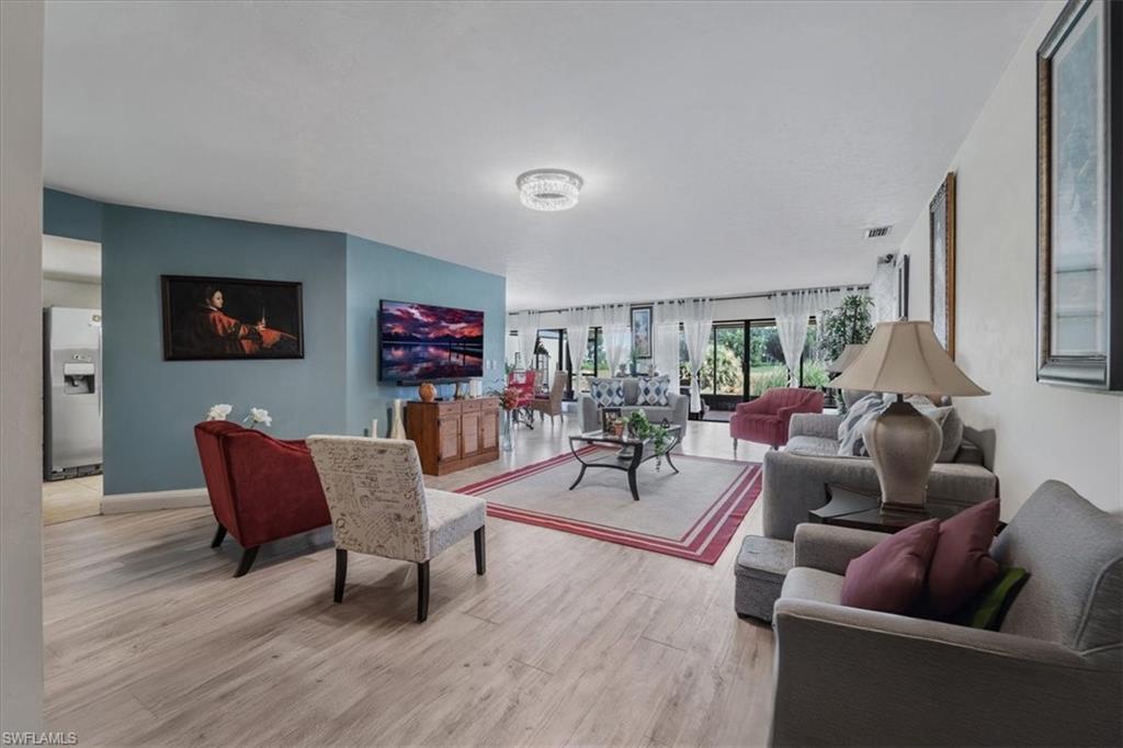Living area featuring light wood finished floors and baseboards