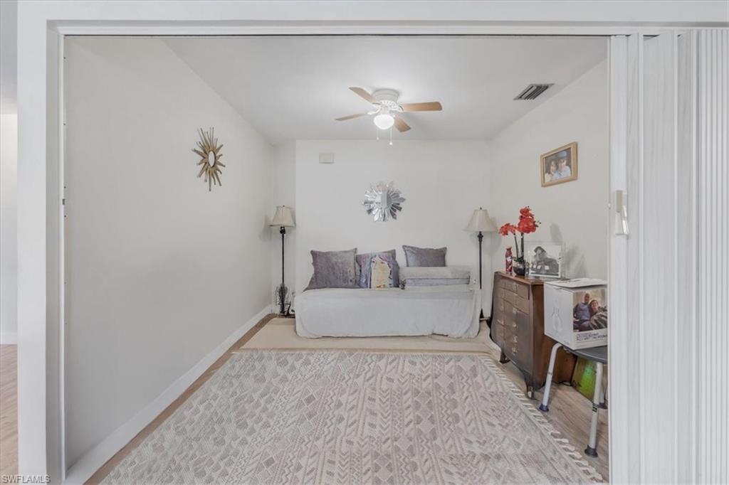 Bedroom featuring light wood-style flooring and a ceiling fan