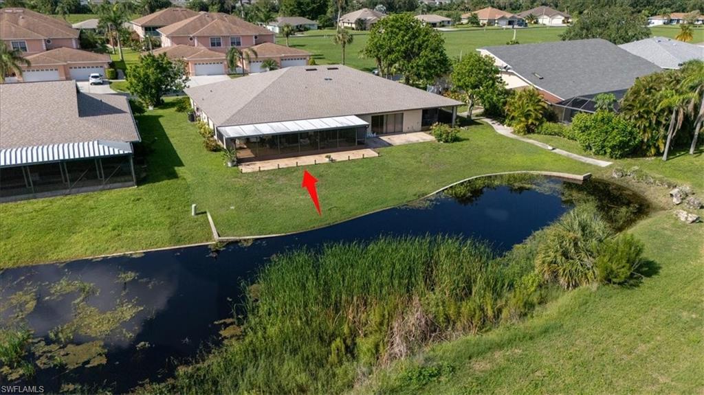 Aerial view of residential area with a large body of water