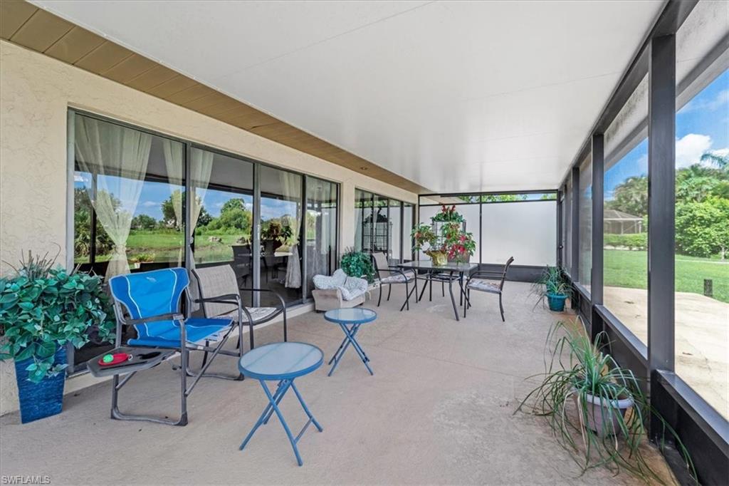 Sunroom featuring outdoor dining space and healthy amount of natural light