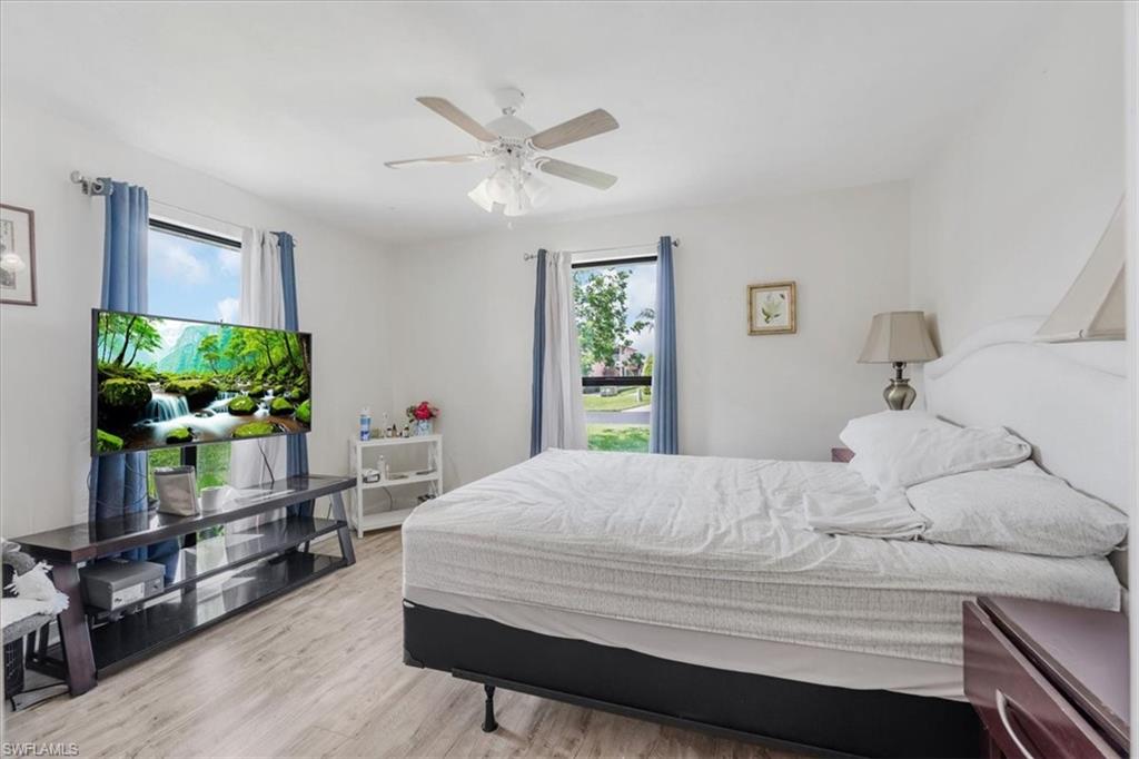 Bedroom featuring light wood-style floors and a ceiling fan