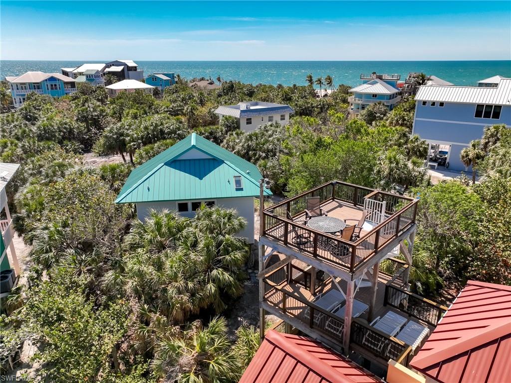 Bird's eye view featuring a water view and a view of the beach