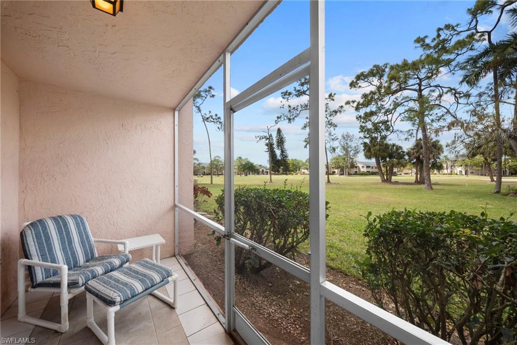 Sunroom featuring vaulted ceiling