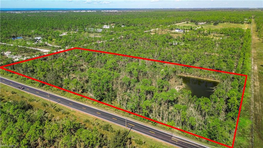 View of property location featuring property boundaries highlighted and a heavily wooded area