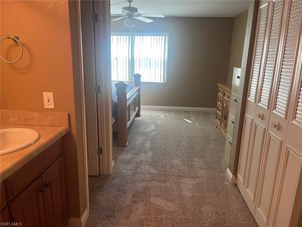 Entering Primary Bedroom with ensuite bathroom