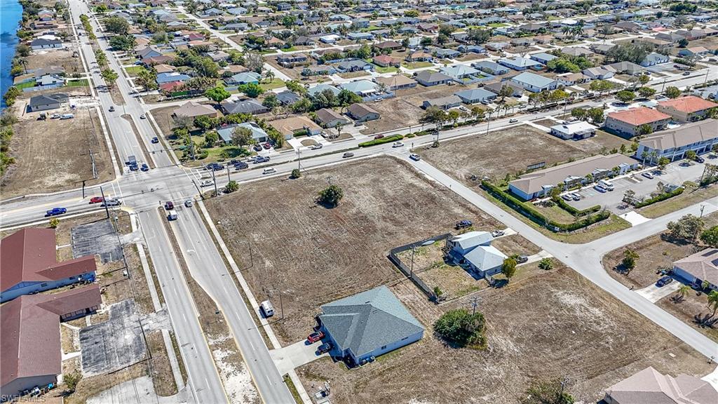 Aerial overview of property's location with nearby suburban area