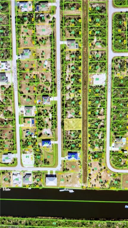 Aerial map of property and surrounding area featuring property parcel outlined