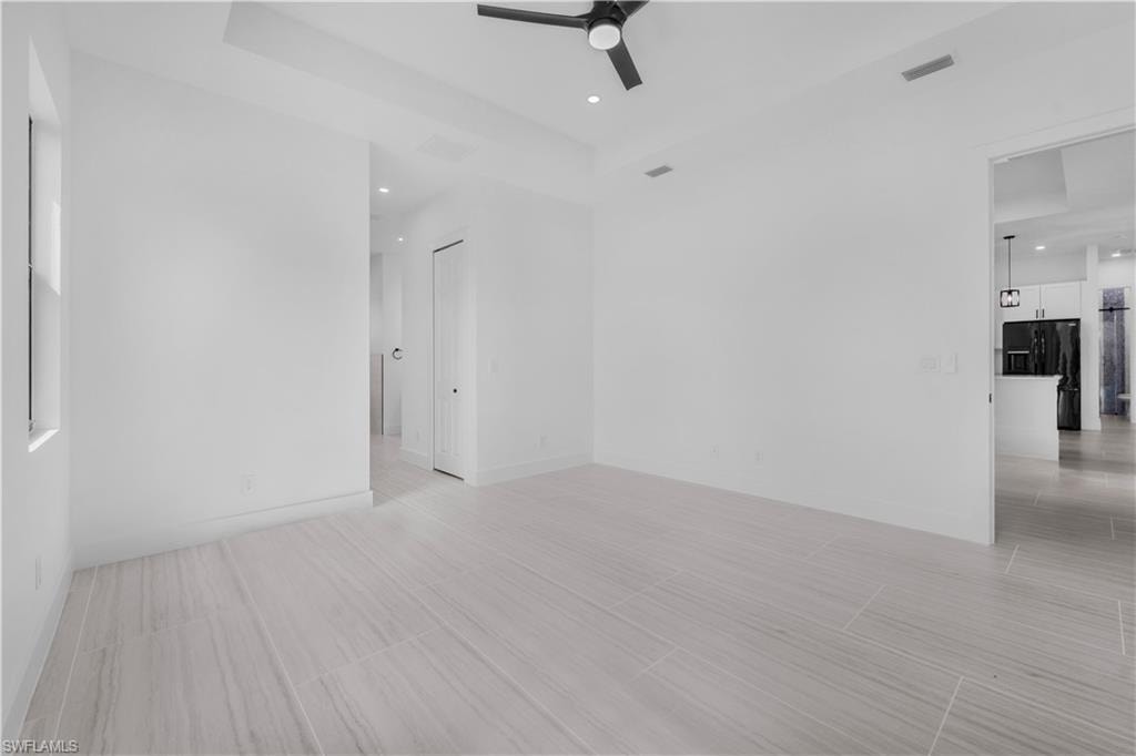 Unfurnished master bedroom with ceiling fan and recessed lighting