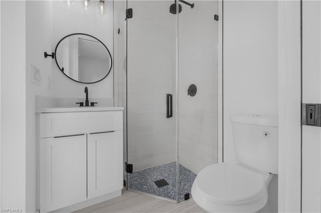 Bath room mother in law with vanity and a shower stall