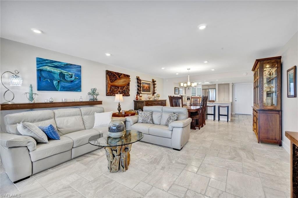 Living room featuring a chandelier